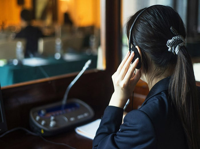 Image of interpreter in a booth